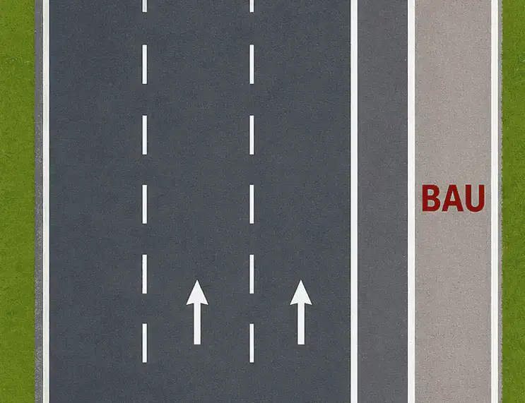 Vue de dessus : zone claire marquée « BAU » à droite, séparée des bandes de circulation par un marquage blanc continu.