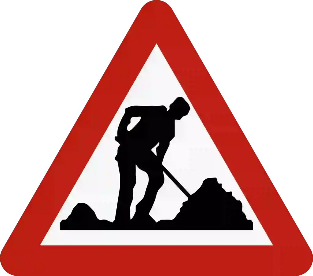 Signal de travaux : triangle à bord rouge, pointe vers le haut, avec un ouvrier tenant une pelle.