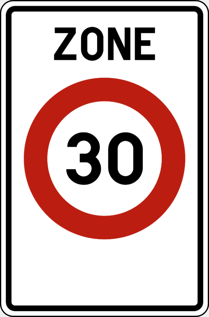 Panneau « ZONE » avec le nombre 30 dans un cercle rouge.