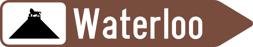 Flèche brune vers la droite portant « Waterloo » et le symbole de la butte du Lion.
