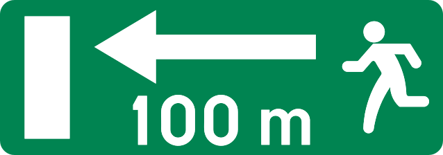 Panneau vert avec une personne, une porte, une flèche vers la gauche et la distance « 100 m ».